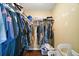 Walk-in closet with ample hanging space and built-in shelving for storage at 30641 County Road 435, Sorrento, FL 32776