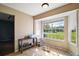 Sunny dining area featuring a large window providing natural light and scenic views, with tile flooring at 30641 County Road 435, Sorrento, FL 32776
