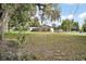 A partial exterior view from a lush green front yard at 30641 County Road 435, Sorrento, FL 32776
