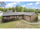 Charming brick home featuring a well-maintained lawn and inviting curb appeal with mature trees and plantings at 30641 County Road 435, Sorrento, FL 32776