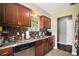 Well-appointed kitchen with tile flooring, stainless steel dishwasher, and ample counter space at 30641 County Road 435, Sorrento, FL 32776