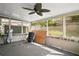 Enclosed patio featuring a ceiling fan and views of the fenced backyard at 30641 County Road 435, Sorrento, FL 32776