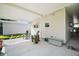 Relax on the back porch with comfortable seating at 3209 Manatee Rd, Tavares, FL 32778