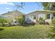 Beautiful backyard with a patio and green lawn at 3209 Manatee Rd, Tavares, FL 32778