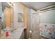 Bathroom with shower, vanity, and storage at 3209 Manatee Rd, Tavares, FL 32778