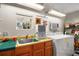 Laundry room features a sink, washer, and dryer at 3209 Manatee Rd, Tavares, FL 32778
