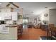 Open-concept layout featuring a kitchen bar, living area with ample seating, and abundant natural light at 3209 Manatee Rd, Tavares, FL 32778