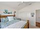 Comfortable bedroom boasts a wooden bed, decorative mermaid and seahorse accents, and a closet at 3222 Miller Stachler St, The Villages, FL 32163