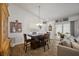 Inviting dining area features a table with seating, a slider to the patio, and bright natural light at 3222 Miller Stachler St, The Villages, FL 32163
