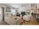 Open living area with a view to the kitchen and slider, bright with natural light at 3222 Miller Stachler St, The Villages, FL 32163