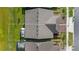 Aerial view of home with brown roof and driveway outlined with white line at 3256 Canna Lily Pl, Clermont, FL 34711