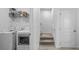 Convenient laundry room with modern appliances at 3256 Canna Lily Pl, Clermont, FL 34711