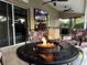 Relax on the patio next to the firepit and enjoy the view of the pool and grill at 3511 Fox Lake Dr, Apopka, FL 32712
