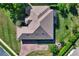 Aerial view of the house showing its roof and landscaping, including the brick driveway at 39705 Grove Hts, Lady Lake, FL 32159