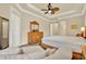 Relaxing bedroom with carpet, ceiling fan, and neutral decor at 39705 Grove Hts, Lady Lake, FL 32159