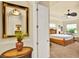 Comfortable carpeted bedroom, featuring the main bedroom, with tray ceiling and ceiling fan at 39705 Grove Hts, Lady Lake, FL 32159