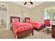 Inviting bedroom with two twin beds, a desk area, carpet, and a bright window with shutters at 39705 Grove Hts, Lady Lake, FL 32159