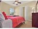 Comfortable bedroom with two twin beds, a desk area, closet, and carpeted floors at 39705 Grove Hts, Lady Lake, FL 32159