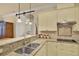 Modern kitchen featuring granite countertops, a stainless sink, and white cabinetry at 39705 Grove Hts, Lady Lake, FL 32159