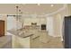 Spacious kitchen featuring light cabinets, granite countertops, tile flooring and stainless steel appliances at 39705 Grove Hts, Lady Lake, FL 32159