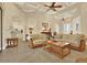 Spacious living room features coffered ceiling and seamlessly connects to other rooms at 39705 Grove Hts, Lady Lake, FL 32159