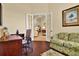 Comfortable office area with French doors leading to a tiled living space at 39705 Grove Hts, Lady Lake, FL 32159