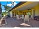 Inviting covered outdoor patio with brick flooring, ceiling fans, and ample seating at 39705 Grove Hts, Lady Lake, FL 32159
