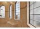 Elegant shower with tiled walls, glass block windows, a built-in bench and a showerhead at 39705 Grove Hts, Lady Lake, FL 32159
