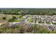 Residential neighborhood with tree-lined streets showcases a peaceful and well-planned community layout at 444 Shadow Gorge Way, Eustis, FL 32736