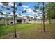 Spacious backyard featuring a well-maintained lawn and fence that enhances privacy and adds security at 444 Shadow Gorge Way, Eustis, FL 32736
