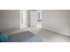 This bedroom has neutral walls, carpeted floors, and is well-lit, with doors and glimpses of other rooms at 444 Shadow Gorge Way, Eustis, FL 32736