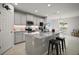 Modern kitchen featuring granite countertops, stainless steel appliances, and bar seating at 444 Shadow Gorge Way, Eustis, FL 32736