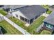 Aerial view of the property showing the backyard, screened patio, and fenced yard at 449 Gilson Loop, The Villages, FL 32163