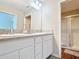 Bathroom featuring double sinks, a spacious shower with glass doors, and modern fixtures at 449 Gilson Loop, The Villages, FL 32163