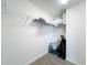 Walk-in closet with wire shelving, ample storage space, and neutral carpeting at 449 Gilson Loop, The Villages, FL 32163