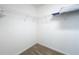 Empty walk-in closet featuring white walls, carpeted floor, and wire shelving ready for organization at 449 Gilson Loop, The Villages, FL 32163