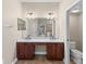 Elegant bathroom with double sinks, vanity, and a separate toilet room at 5138 Rishley Run Way, Mount Dora, FL 32757