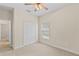 Bedroom with neutral walls, carpet, closet and a view to the hallway at 5138 Rishley Run Way, Mount Dora, FL 32757