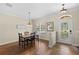A charming dining room offers a warm and inviting space for Gathering gatherings at 5138 Rishley Run Way, Mount Dora, FL 32757