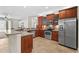 A modern kitchen features stainless steel appliances and ample counter space at 5138 Rishley Run Way, Mount Dora, FL 32757