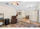 Spacious living area bathed in natural light, connecting the kitchen and dining spaces at 5138 Rishley Run Way, Mount Dora, FL 32757