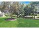 Beautiful backyard featuring mature trees and lush landscaping at 5408 Queen Victoria Dr, Leesburg, FL 34748