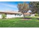 Well-manicured backyard with lush lawn and mature trees at 5408 Queen Victoria Dr, Leesburg, FL 34748