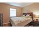 Comfortable bedroom with a hardwood floor and a bedside table at 5408 Queen Victoria Dr, Leesburg, FL 34748