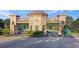 Royal Highlands entrance gate with decorative architecture and lush landscaping at 5408 Queen Victoria Dr, Leesburg, FL 34748