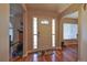 Welcoming entryway with hardwood floors and decorative glass sidelights at 5408 Queen Victoria Dr, Leesburg, FL 34748