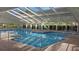A gorgeous indoor pool with a glass ceiling and plenty of space for relaxing at 5408 Queen Victoria Dr, Leesburg, FL 34748