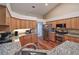 Well-appointed kitchen features granite countertops, stainless steel appliances, and ample cabinet space at 5408 Queen Victoria Dr, Leesburg, FL 34748