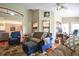 Open concept living room with neutral color palette and hardwood floors at 5408 Queen Victoria Dr, Leesburg, FL 34748