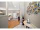 Inviting foyer with hardwood floors that leads into a living room filled with natural light through the French doors at 5557 Freeport Dr, Tavares, FL 32778